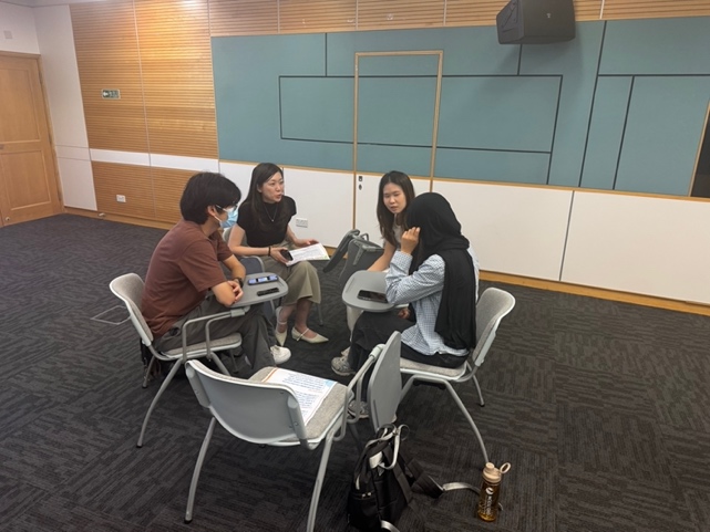 A small group discussing their overseas exchange experiences.