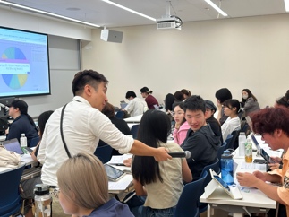 Language Centre staff supporting students during group work.